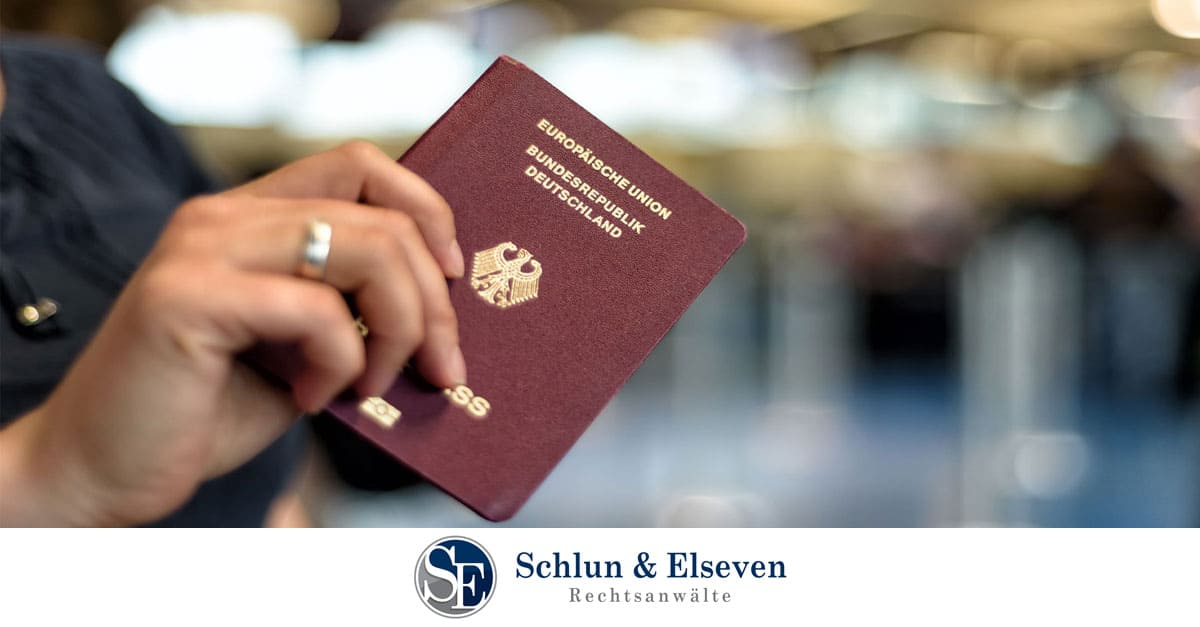 Person with ring holding a German passport
