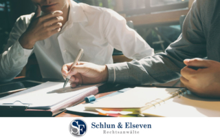 lawyers consulting with documents about GmbH company formation in Germany