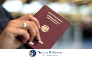 Person holding a German passport in their hand