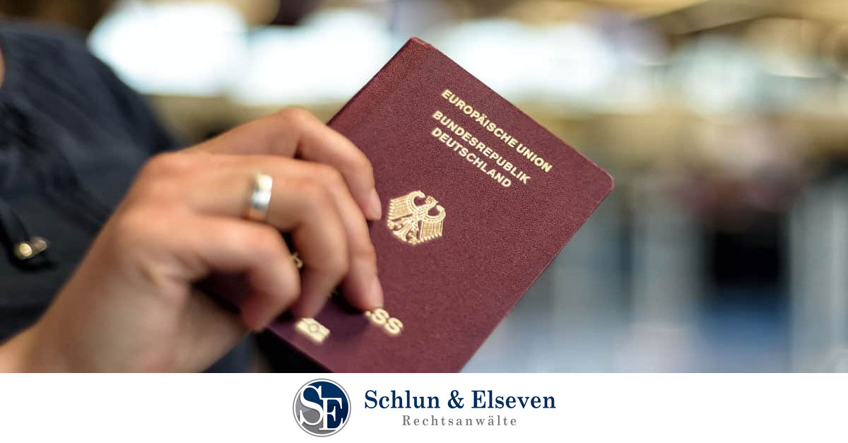 Person holding a German passport in their hand